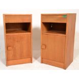 A pair of mid century teak wood pedestal bedside cabinets in the Danish manner having single drawers