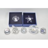 A collection of Swarovski under the sea creatures to include a clam, a puffer fish, a starfish, a