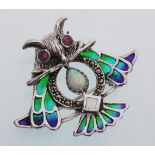 A sterling silver and plique a jour owl brooch pendant inset with a central iridescent stone.