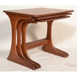 A mid century Danish inspired teak wood nest of tables. Each of graduating form with rectangular