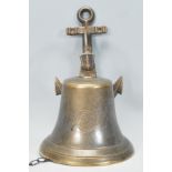 A contemporary novelty brass ships bell / front do