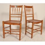 A good pair of early 20th Century oak spindle back chairs having solid inset set pads raised on