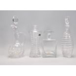 A group of four 20th Century glass to include two Thomas Webb decanters with spiral cut