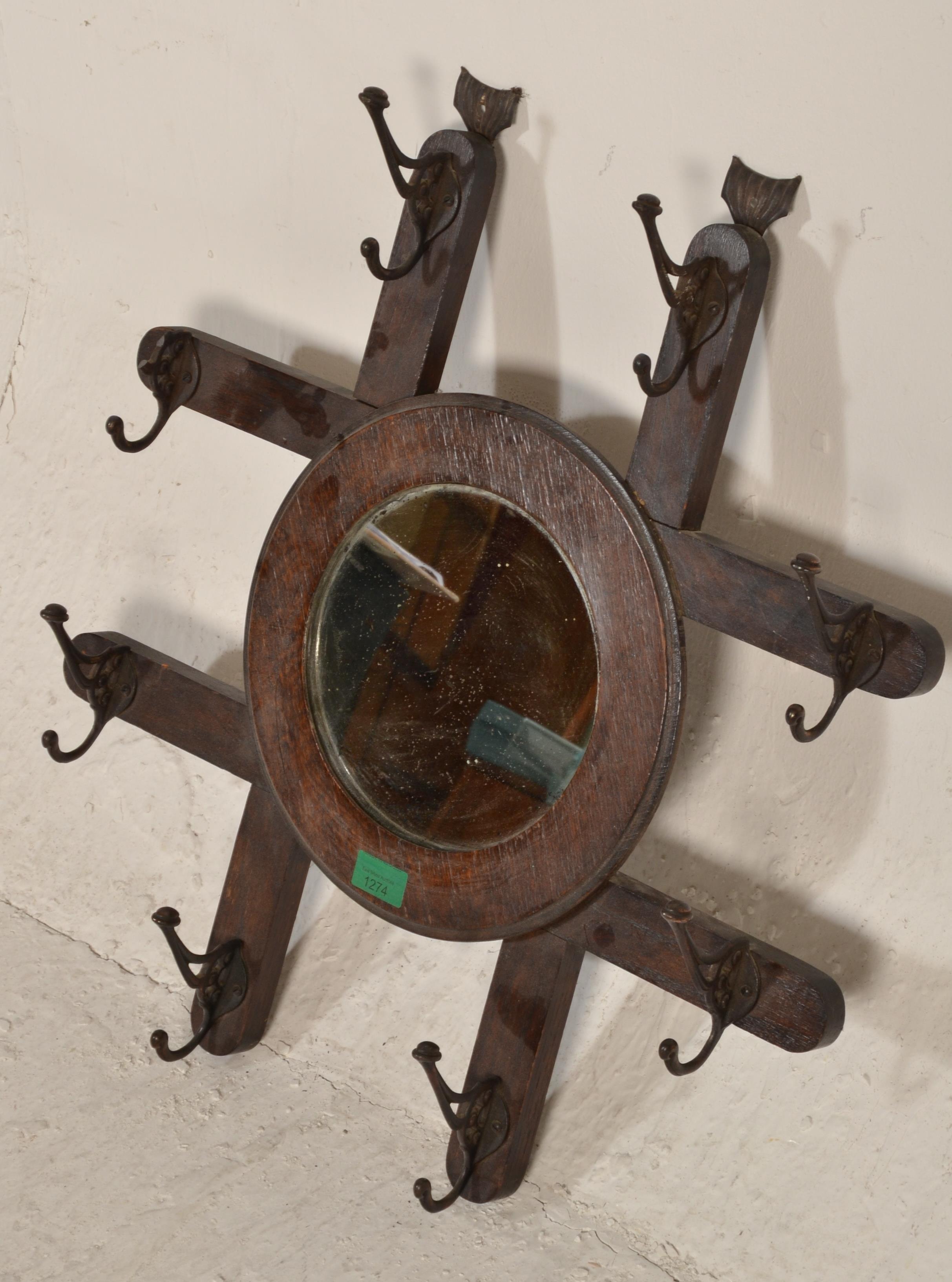 A late 19th century Victorian Arts & Crafts wall mirror coat rack combination. The roundel mirror on - Image 3 of 6