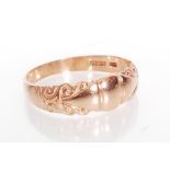 A hallmarked 9ct rose gold  ring having a scrolled cartouche design. Hallmarked Birmingham. Weight