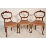 A set of 3 Victorian  19th century mahogany balloon back dining chairs. Raised on cabriole legs with