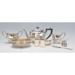 A 20th Century silver plated tea set to include a teapot sugar bowl and creamer, all having reeded