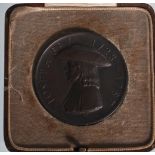 A commemorative Fry & Sons 1928 commemorative medallion having a raised head of Joseph Fry with a