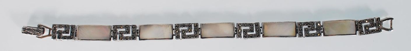 A ladies silver spacer bracelet. Linked alternatel