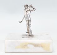 A silver hallmarked desktop figurine in the form o