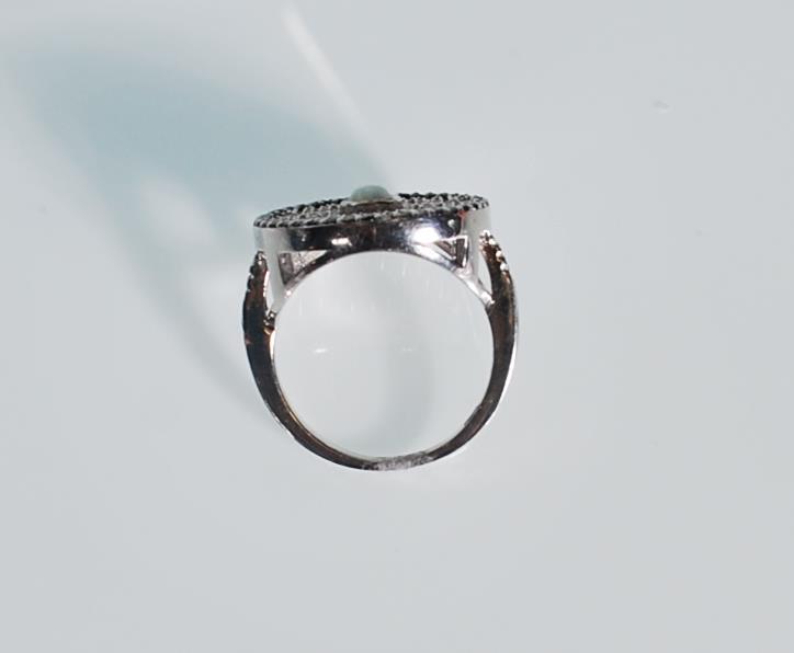 A stamped 925 silver ring. The centre stone is an - Image 5 of 6