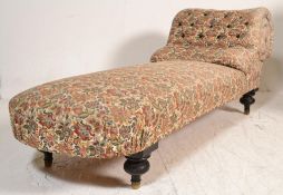 A 20th century chaise lounge having a scrolled bac