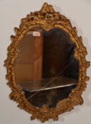 An antique style gilt framed wall hanging mirror o