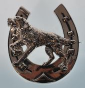 A large sterling silver brooch in the form of a ho