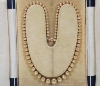 A vintage 14ct gold beaded necklace having graduat