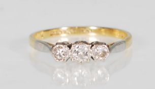 An 18k yellow gold and platinum mounted three ston