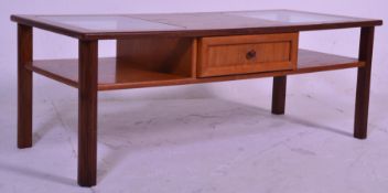A retro mid 20th Century teak wood coffee table of