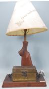 An unusual 20th century table lamp formed from the