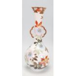 A Japanese stem vase having a bulbous form body wi