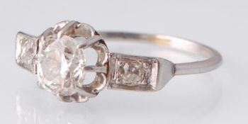 A French Art Deco Platinum Three Stone Diamond Rin