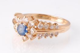 A 14ct gold sapphire and diamond ring. The ring be