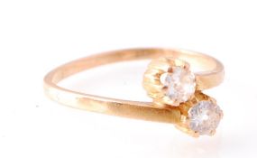 18CT GOLD AND DIAMOND TWO STONE CROSSOVER RING