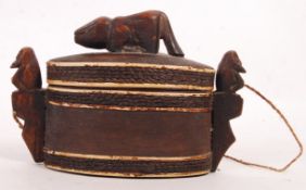 AFRICAN 19TH CENTURY CARVED LIDDED POT WITH LIONES