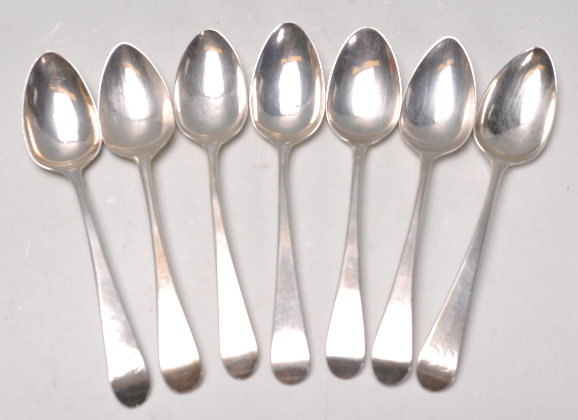 A good set of seven late 18th Century Georgian silver hallmarked tea spoons, with each one bearing a