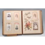 A 19th Century Victorian leather bound embossed photograph album having hand painted pages of