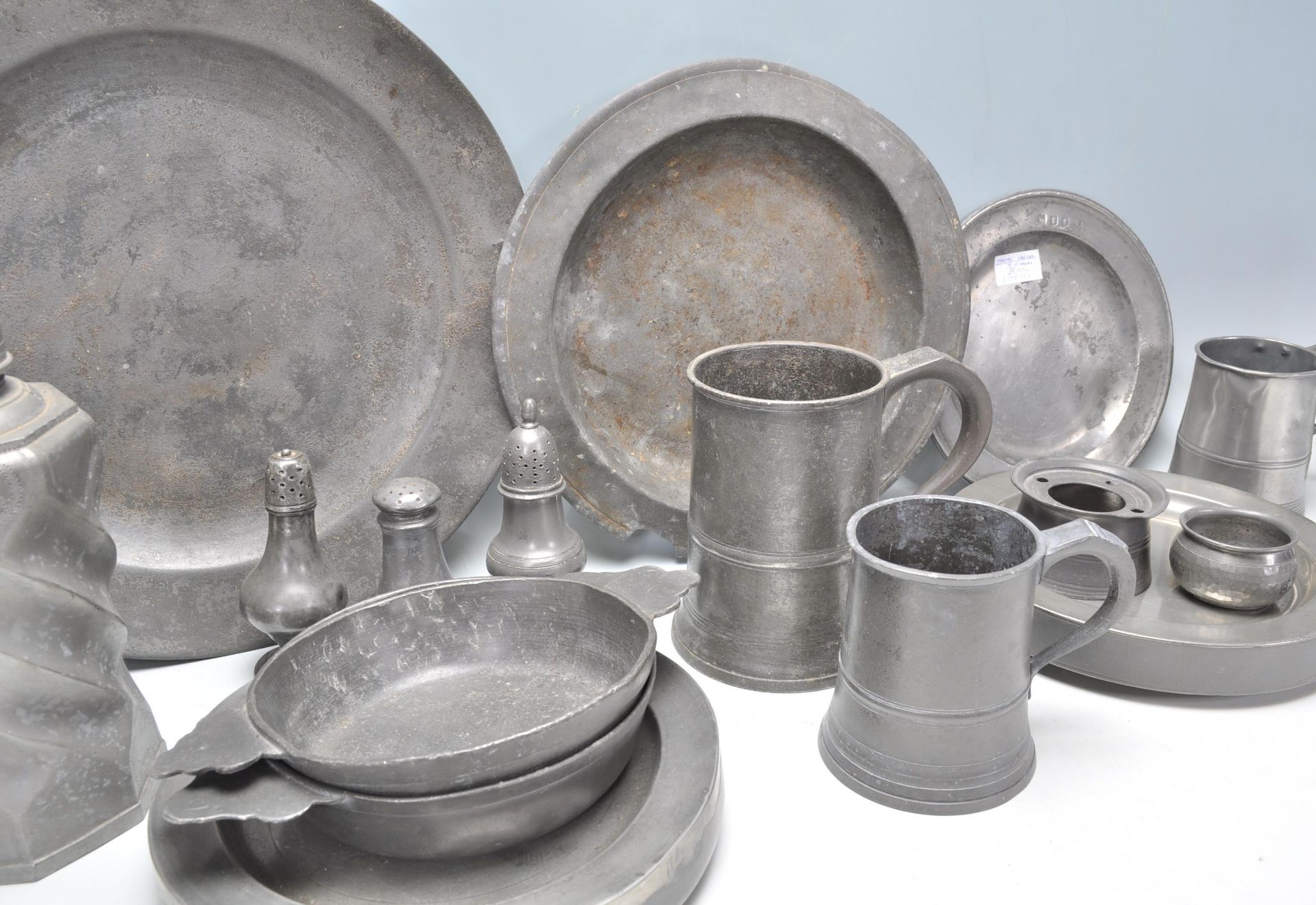 A collection of 18th Century antique pewter wares to include a large selection of plates and - Image 9 of 11