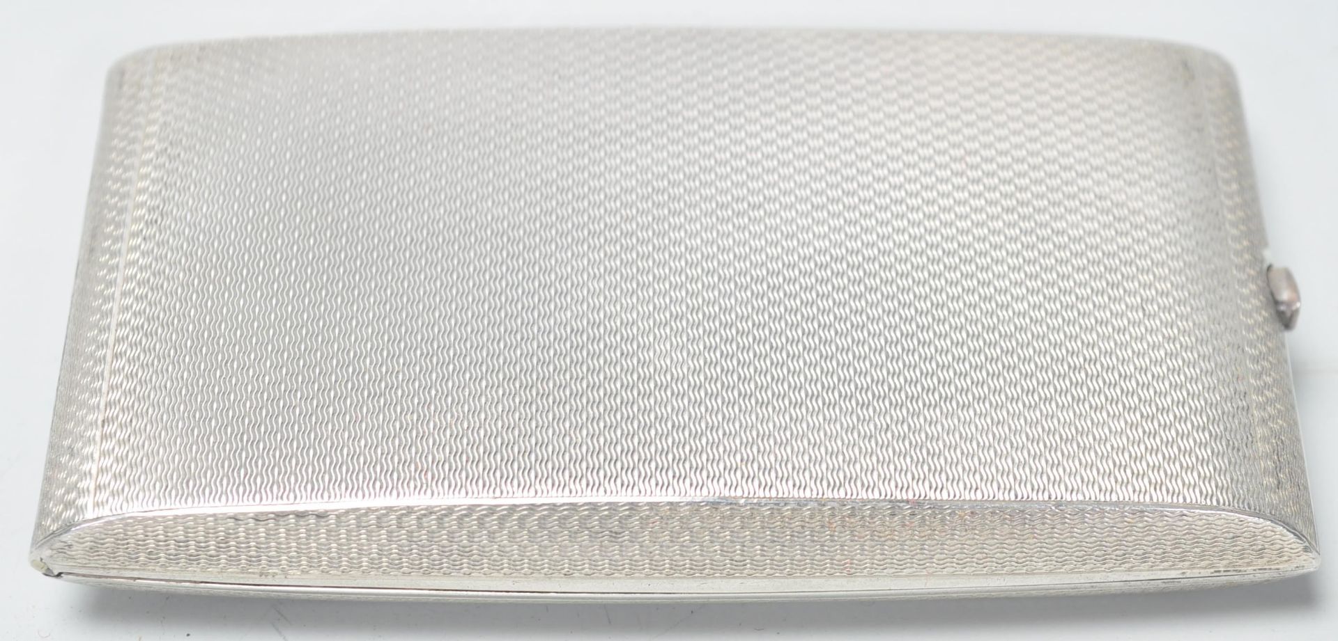 A silver hallmarked cigarette case of rectangular shape having engine turned decoration with - Image 3 of 6