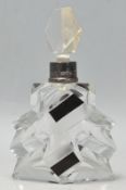 A stunning early 20th Century Art Deco cut glass scent bottle with clear cut glass stopper and black
