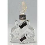 A stunning early 20th Century Art Deco cut glass scent bottle with clear cut glass stopper and black