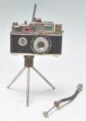 A vintage novelty Photolite Oriental cigarette lighter in the form of a miniature camera complete