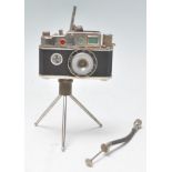 A vintage novelty Photolite Oriental cigarette lighter in the form of a miniature camera complete