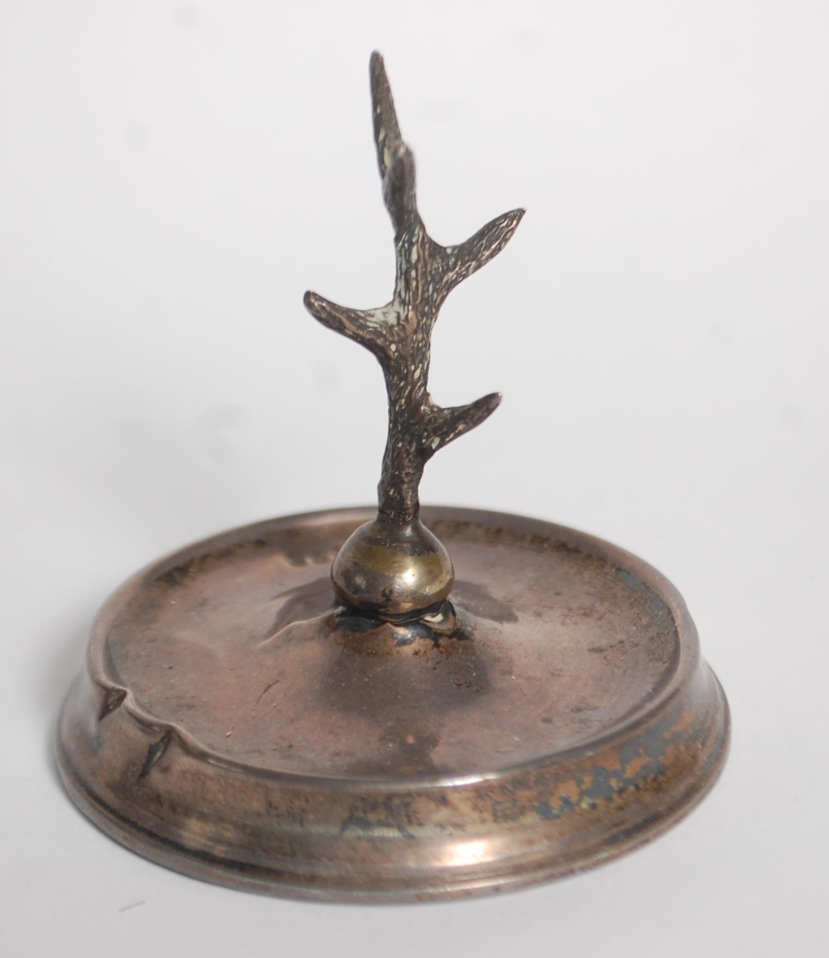 An early 20th Century Art Deco silver hallmarked weighted ring stand in the form of a tree set