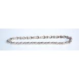 A 9ct white gold ladies bracelet with illusion set diamonds. The bracelet having a box clasp.