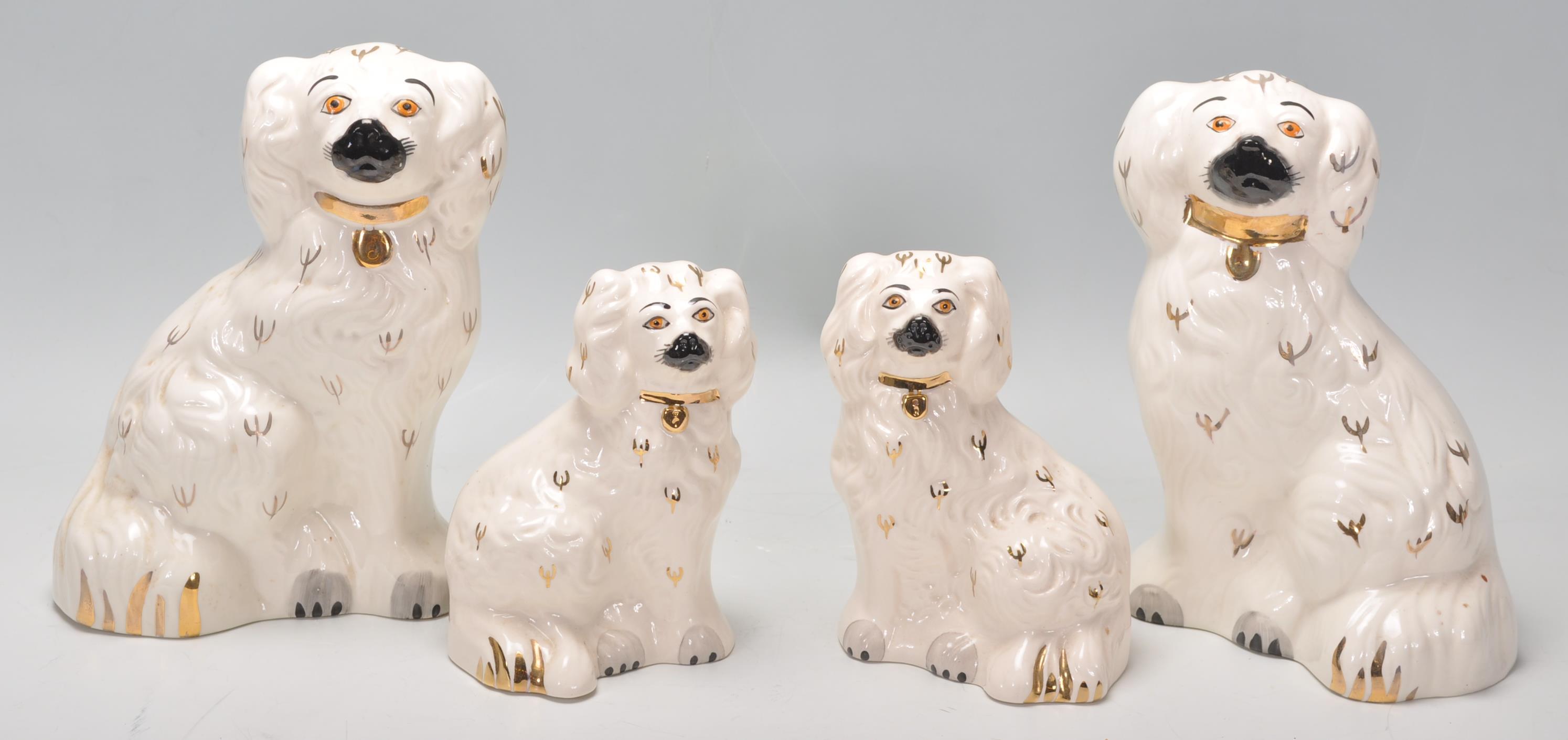 A pair of vintage early 20th Century Beswick ceramic fireside dogs together with a smaller pair of