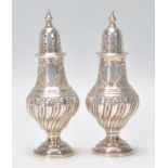 A good matching pair of late 19th Century Victorian silver hallmarked pepperette table condiments