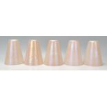 A collection of five 20th century retro conical lustre glass lamp shades. Each of conical form