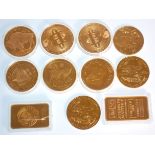 A mixed group of mostly gold plated coins to include 2x 2013 copper Bitcoin coins, commemorative