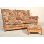 A good Ercol Saville light elm three seater sofa settee having raised spindle back with shaped