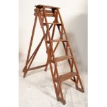 A good early 20th century Industrial wooden a-frame folding ladder with trestle ends complete with