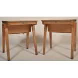 A pair of mid century beech wood school desks being raised on bentwood arched legs with hinged