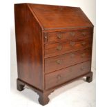 A good 19th Century Georgian mahogany bureau desk. The fall front revealing a fitted interior of