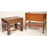 A good retro 20th Century teak wood tea trolley having two drop leafs with second tier below