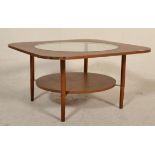 A vintage retro 20th Century melamine topped coffee table having inset circular glass top. Raised on