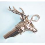 A stamped Sterling silver whistle pendant in the form of a stag with moulded detailing. Weight