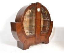 A 1930's Art Deco walnut china roundel display cabinet vitrine. The round circular cabinet with twin