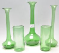 A collection of believed 19th century green Nailsea glass to include three solifleur single stem